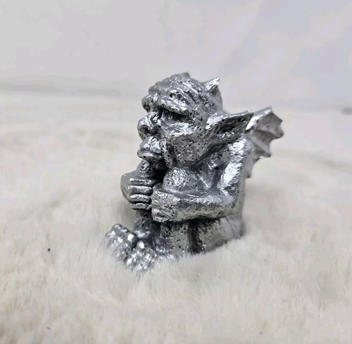 Chrome painted gargoyle with - chrome,